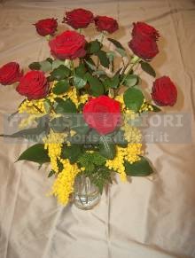 Bouquet of  red roses long-stemmed and mimosa flowers Women´s Day red roses and mimosa